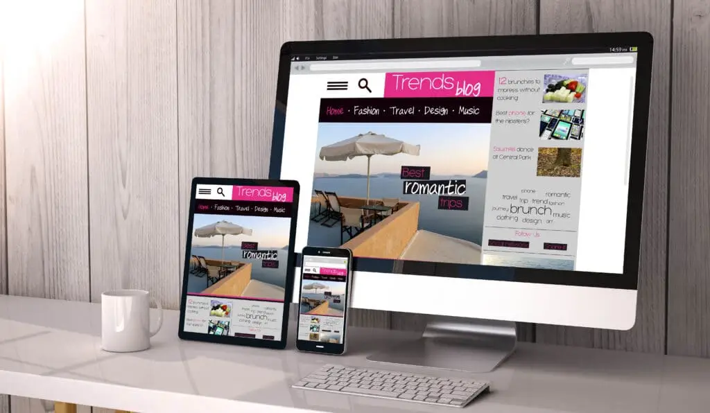 a computer and a phone on a table