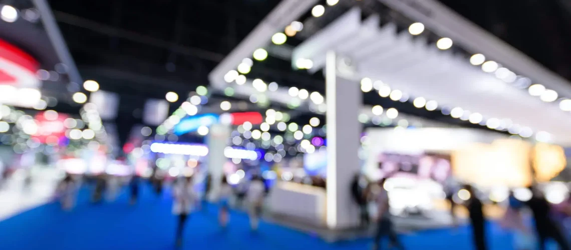 a blurry image of people walking in a blue carpet