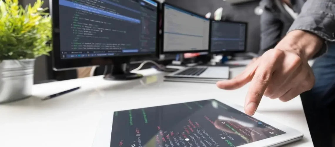 a man pointing at a tablet